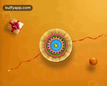 a greeting card for raksha bandhan with a circle with a red ribbon and a gift box
