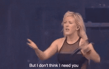a woman is dancing on a stage and says but i don 't think i need you .