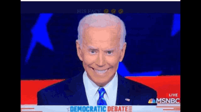 a man in a suit and tie is smiling while appearing on msnbc during a democratic debate