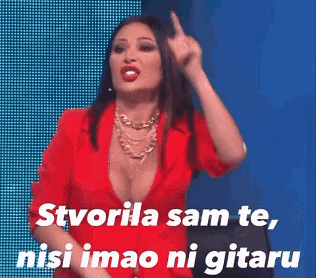 a woman in a red jacket is making a funny face with the words " stvorila sam te "