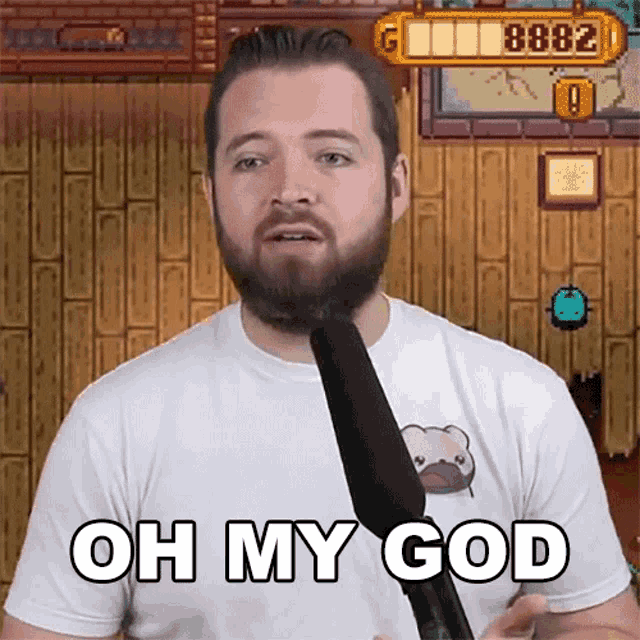 a man with a beard is holding a microphone with the words oh my god written on it