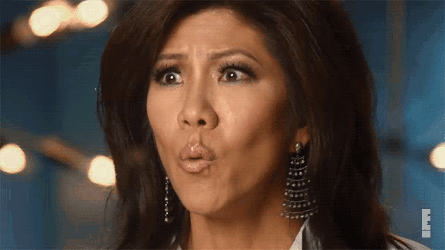 a close up of a woman making a face with the letter e on the bottom right