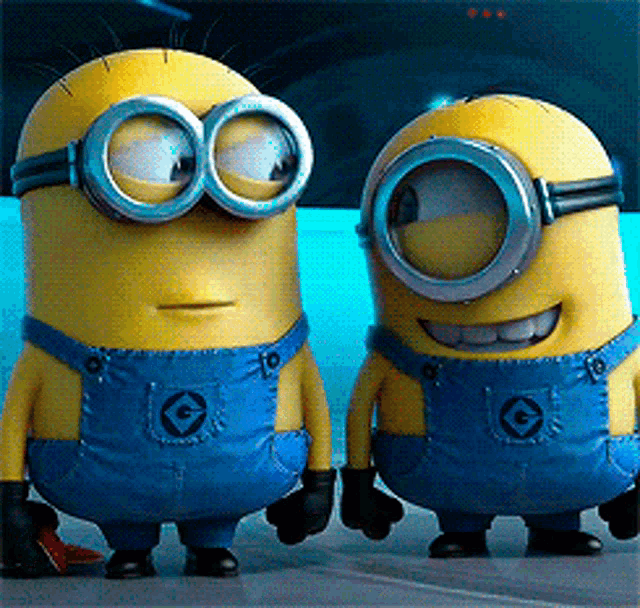 two minions wearing goggles and overalls with the letter g on them