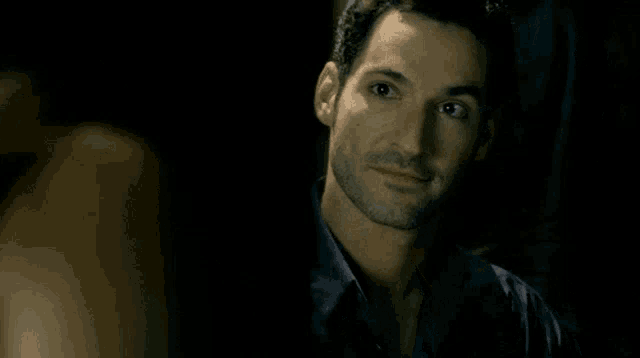 a close up of a man 's face with a smile on his face