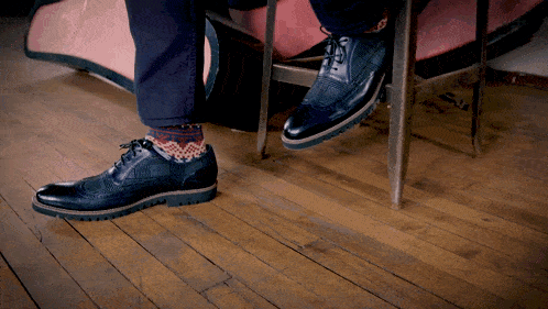 a person wearing a pair of socks and shoes