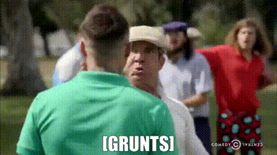 a group of men are standing on a golf course and one of them is saying i gruntsi .