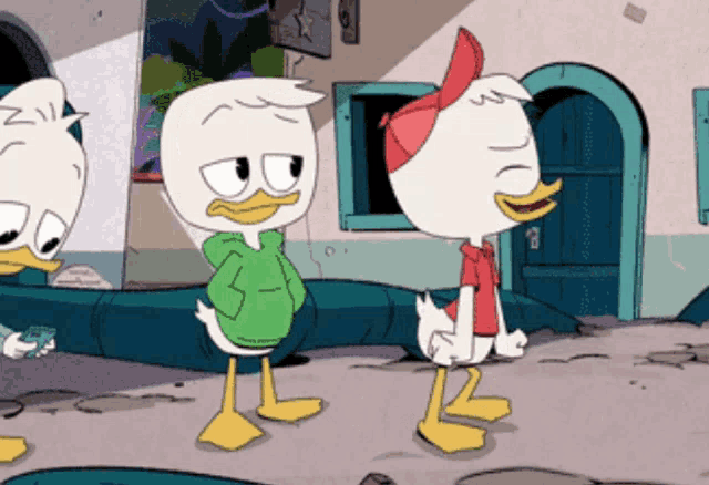 a cartoon duck wearing a green hoodie is standing next to another duck