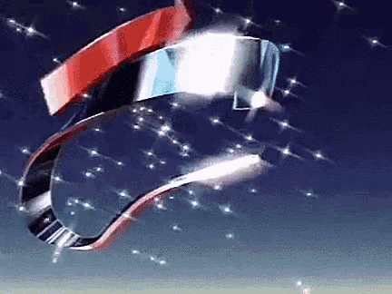 a close up of a red white and blue object in the sky