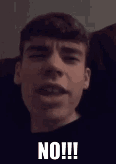a man is making a face with his mouth open and the word no is on the bottom