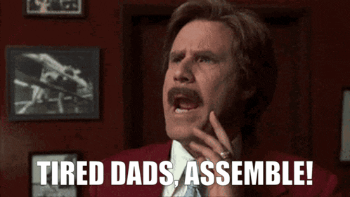 a man in a red suit and tie says tired dads assemble