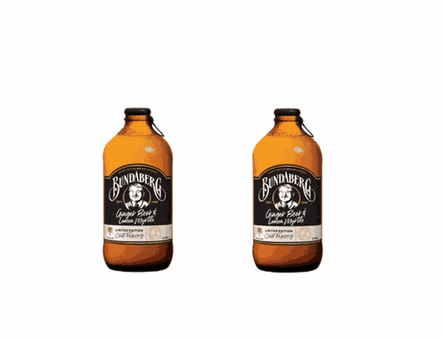 two bottles of bundaberg ginger beer and lemon apple are floating in the air