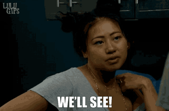 a woman says " we 'll see " while looking at something