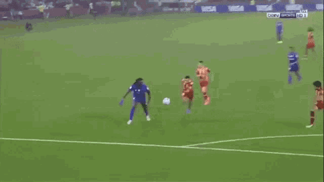 a soccer game is being played in front of a sign that says visa on it