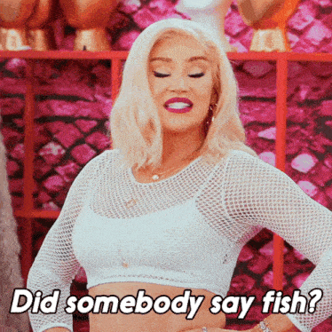 a woman says did somebody say fish in a white crop top