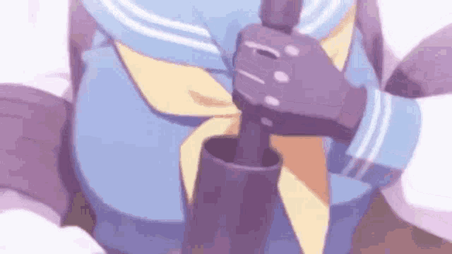 a girl in a sailor suit is holding a stick in her hands .