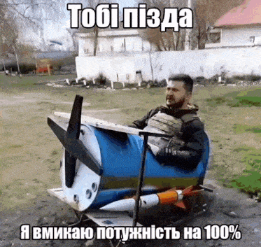 a man is sitting in a toy airplane with a rocket attached to it ..