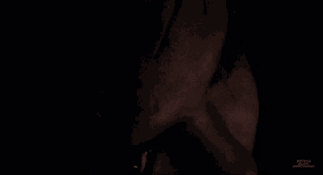 a close up of a person 's face in the dark with a watermark that says python on the bottom right