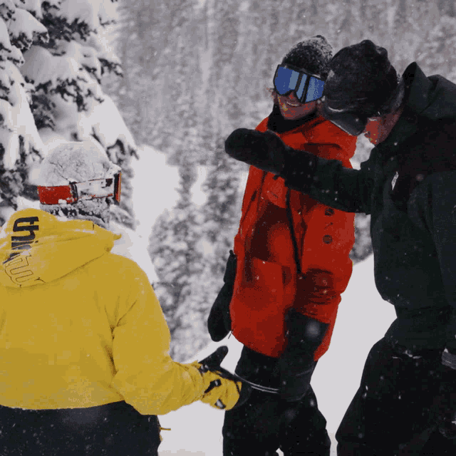 a person wearing a yellow hoodie that says ' altitude ' on the back