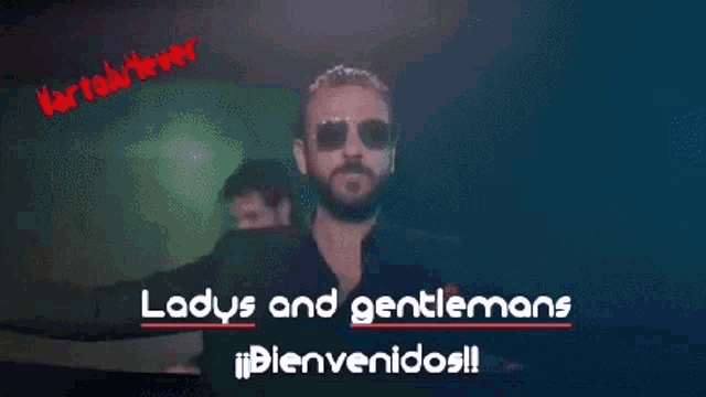 a man in a suit and sunglasses says ladys and gentlemans bienvenidos