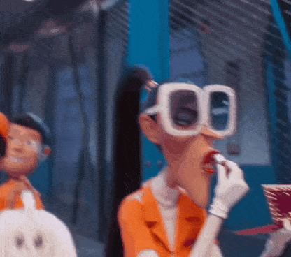a cartoon character wearing glasses is eating a cupcake .
