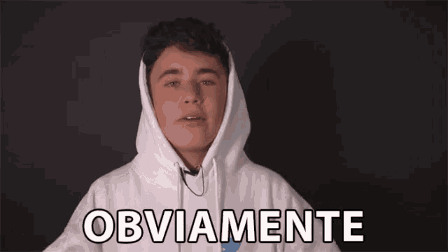 a young man wearing a white hoodie is making a funny face and saying obviously .