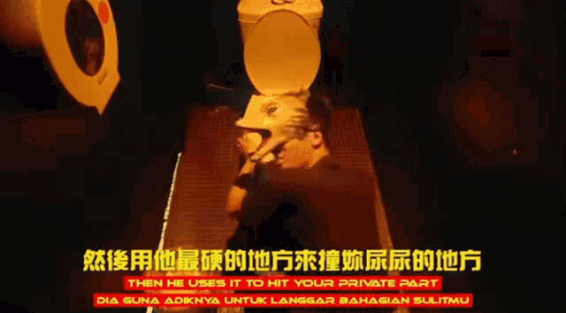 a man laying on a toilet with chinese writing on the bottom