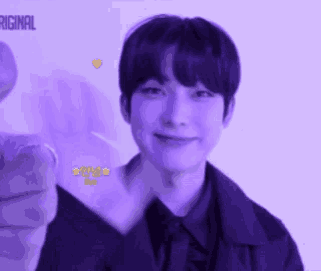 a close up of a person 's face with a purple background and the word original on it