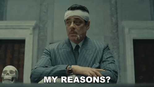 a man with a bandage on his head is sitting at a table and says my reasons