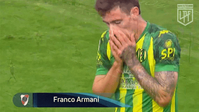 a man in a green and yellow jersey with franco armani written on the front