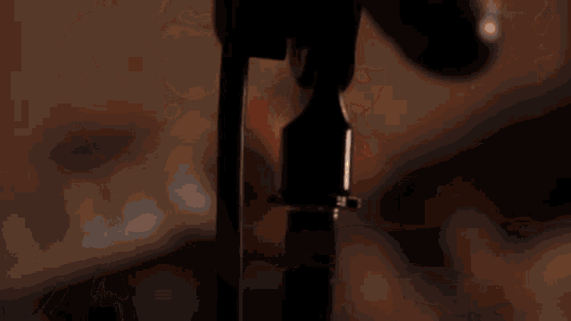 a man is singing into a microphone while playing a guitar
