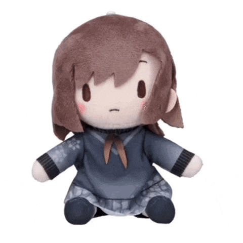 a stuffed toy of a girl with brown hair