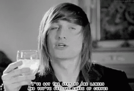 a black and white photo of a man holding a glass of milk and a quote .