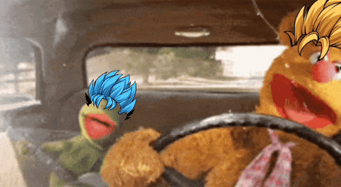 two stuffed animals are sitting in a car one has blue hair and the other has yellow hair