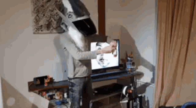 a man wearing a shark mask is standing in front of a computer