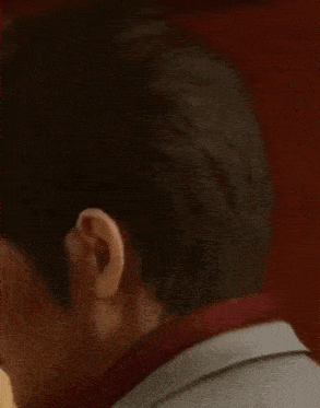 a close up of a man 's face with a serious look on his face in a video game .