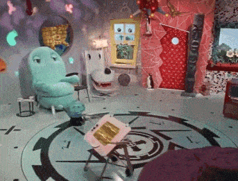 a room with a clock on the floor that says t.