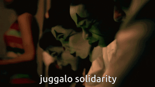 a blurred image with the words juggalo solidarity in white letters