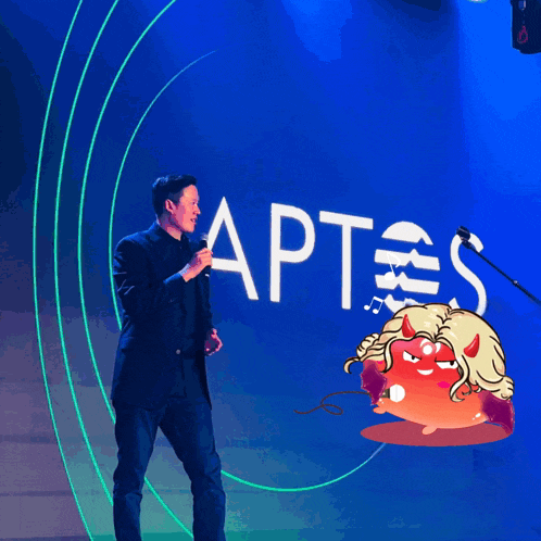 a man in a suit stands in front of a sign that says aptes