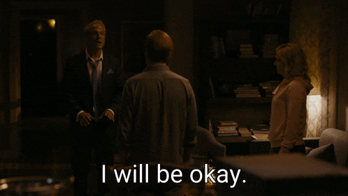 a group of people standing in a dark room with the words i will be okay on the bottom