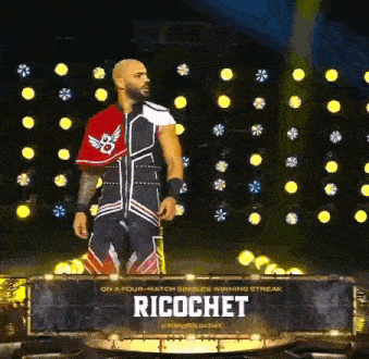 a wrestler with the name ricochet on a sign