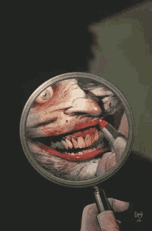 a person holding a magnifying glass with a picture of a clown on it