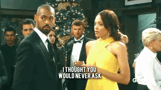 a man in a tuxedo stands next to a woman in a yellow dress who says i thought you would never ask