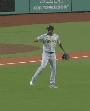 a man in a pittsburgh baseball uniform is holding a glove