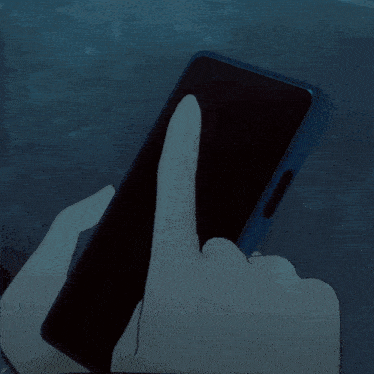 a person 's hand is holding a cell phone with a blue case