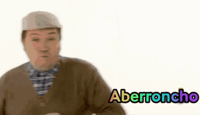 a man wearing a hat and a cardigan with the word aberroncho written on it