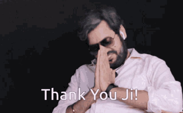 a man praying with the words thank you ji written on the bottom