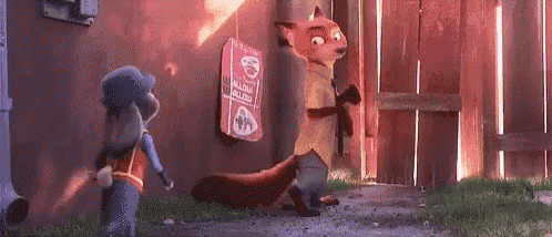 judy hopps and nick wilde from zootopia are standing next to each other in front of a building .