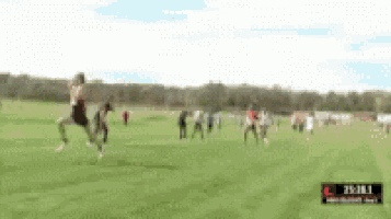 a blurry picture of people running on a field with a time of 25 : 38.1