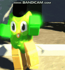 a green and yellow cartoon character with the website www.bandicam.com on the bottom