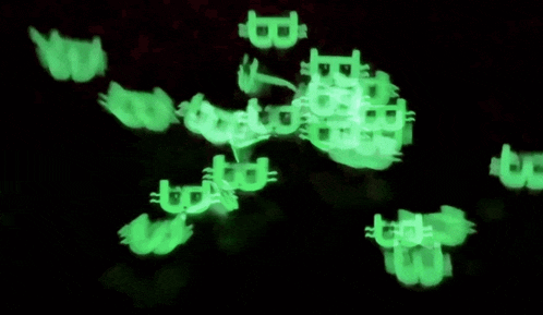 a bunch of glow in the dark b 's are floating in the air